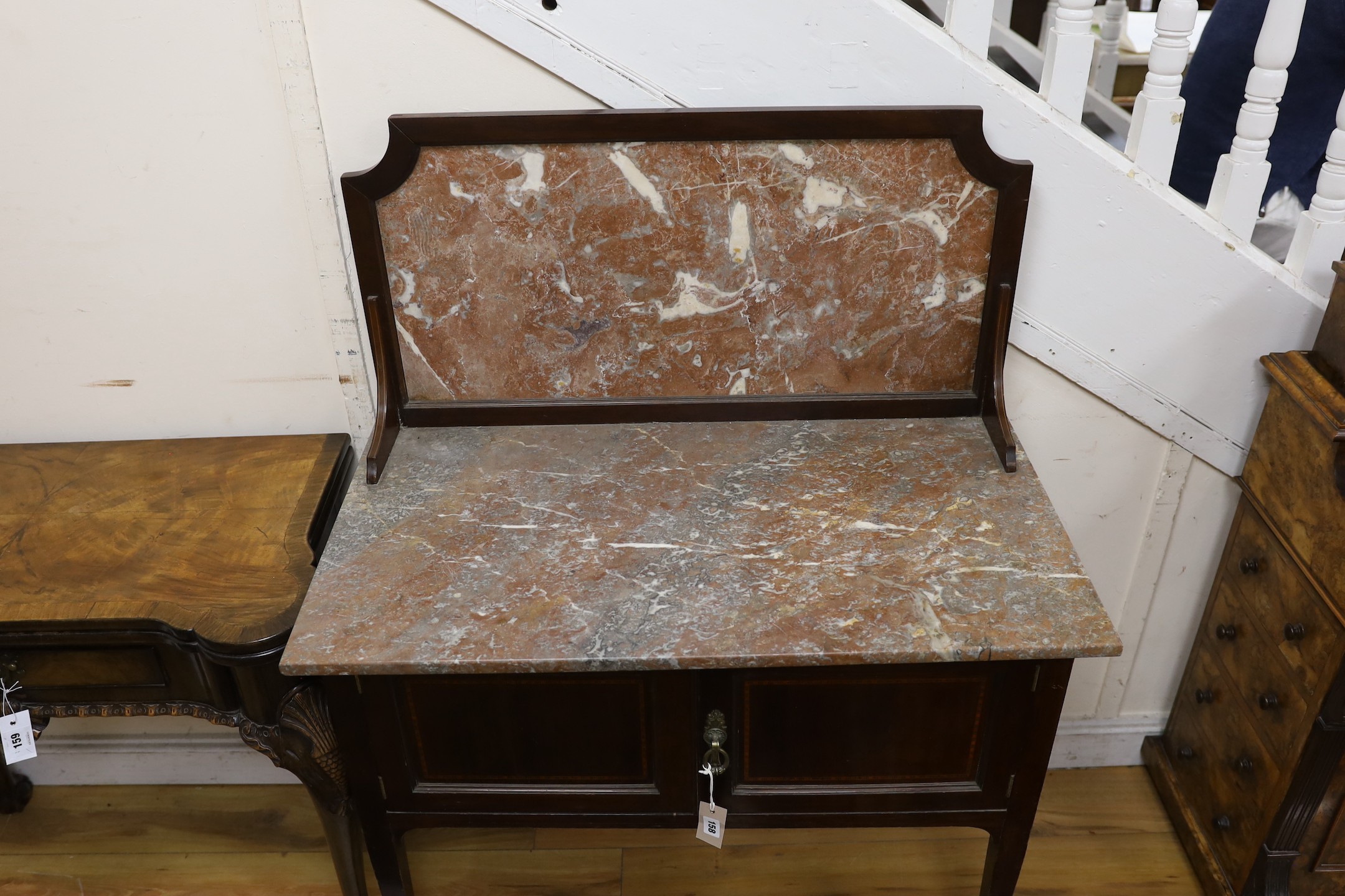An Edwardian mahogany marble topped washstand, width 91cm, depth 51cm, height 122cm